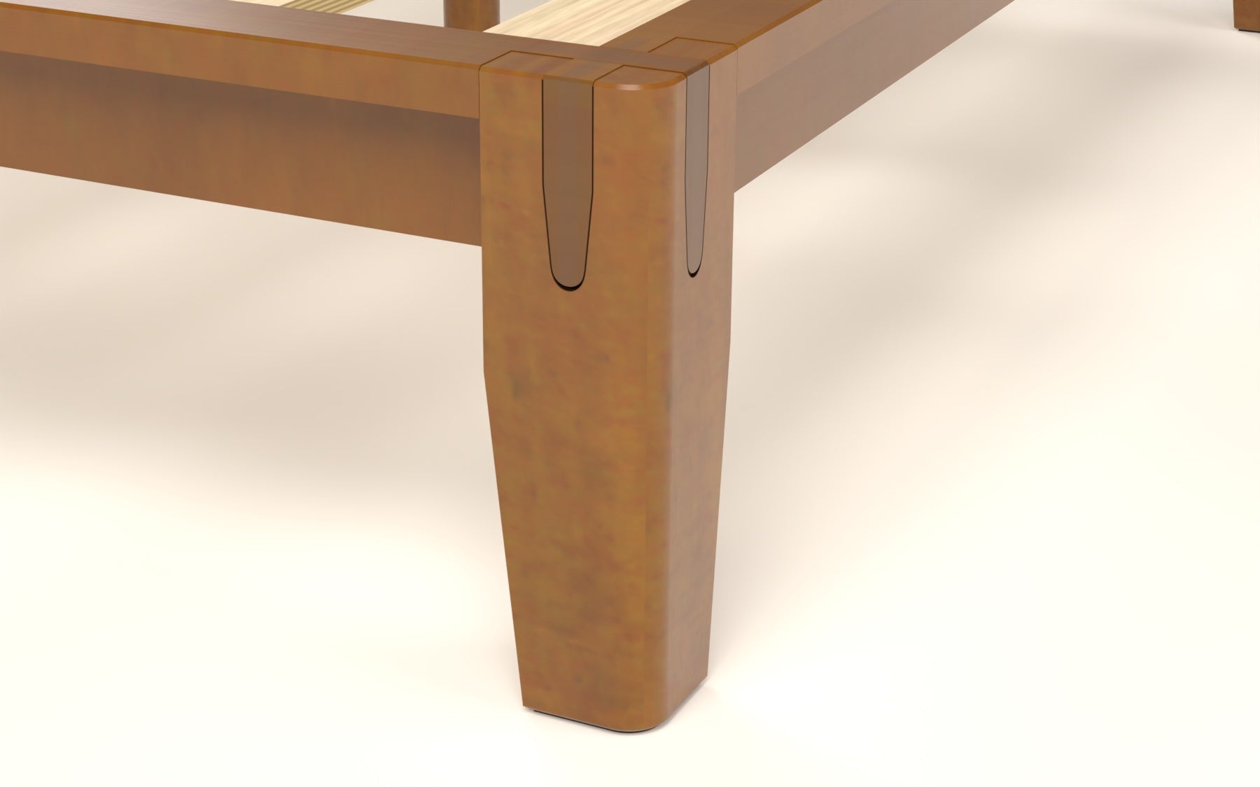 Assembled Brintavo corner showing the rounded U-shaped rail joints seated in the solid rubberwood leg