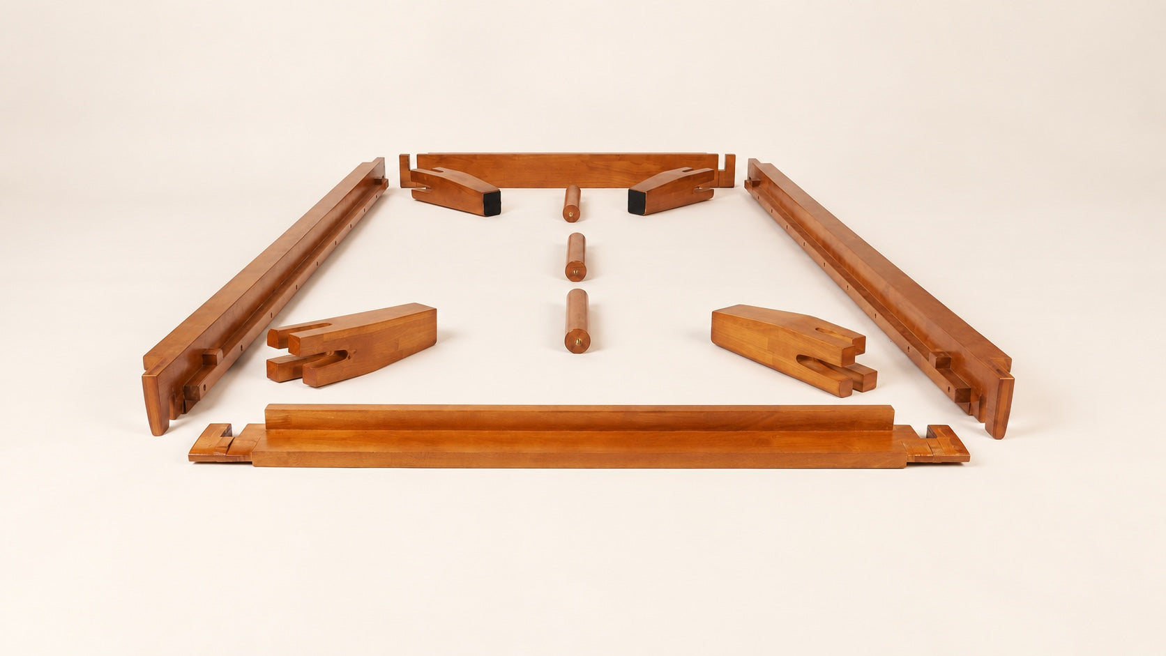 Solid rubberwood Brintavo main rails, corner legs and center support feet arranged before assembly