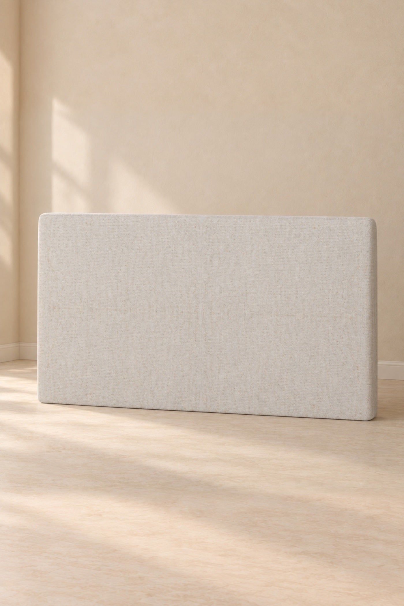 Complete Brintavo beige upholstered Headboard in an extended warm minimal room