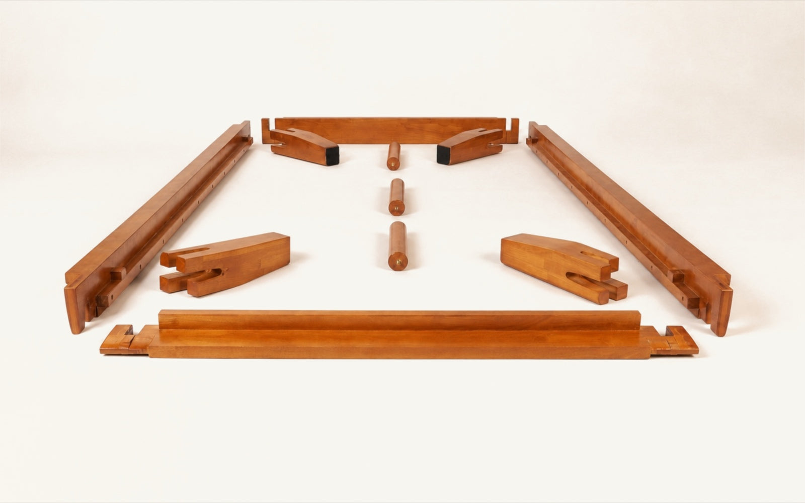 Brintavo solid-rubberwood main rails, corner legs and support feet arranged before assembly